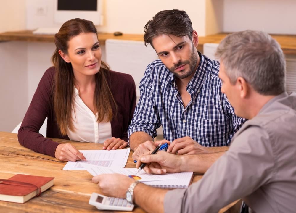 Couple talking with a local business advisor